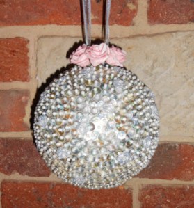 this contains 1200 buttons,  1200 pins and took about 10.5 hours.  Definitely a one off (or three off)!