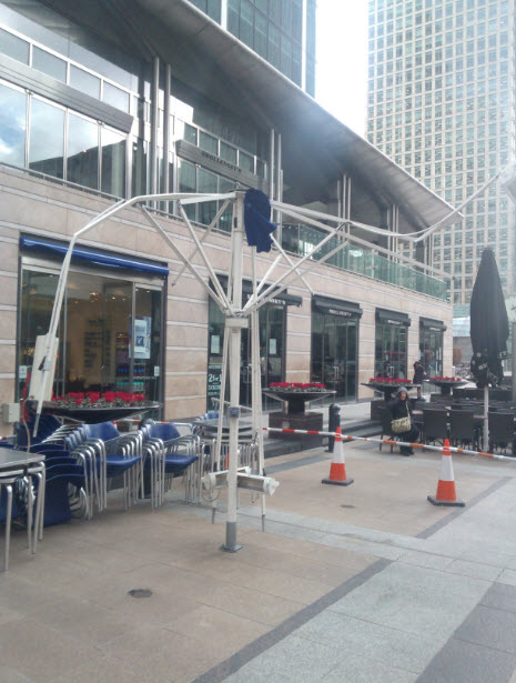 27th January 2014: The strong winds got to the restaurant umbrellas at Canary Wharf. I tried to start a rumour that actually a giant elephant had sat on this one, but people just looked at me funny...