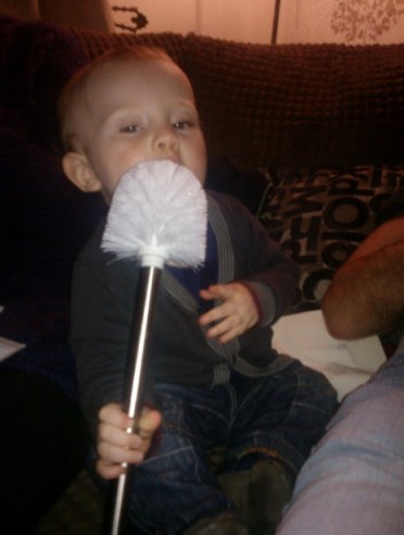 23rd February 2014: Little Pea eating a (brand new) toilet brush.  Obviously.