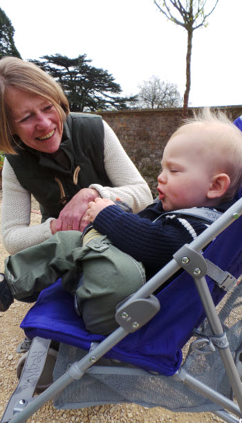 demonstrating yoga moves to Nanny B