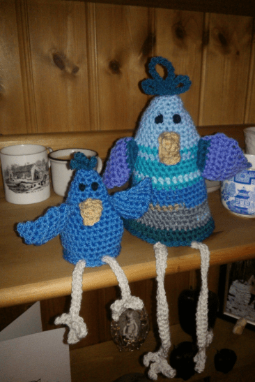 egg cosy on the left, giant chicken on the right